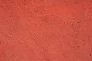 Texture of old wall covered with red stucco