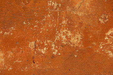 Texture of old wall covered with brown stucco