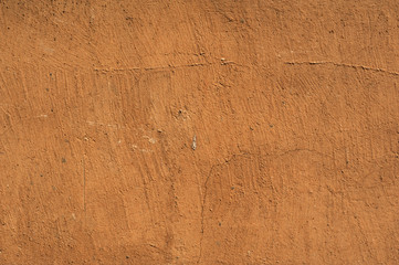 Texture of old wall covered with brown stucco