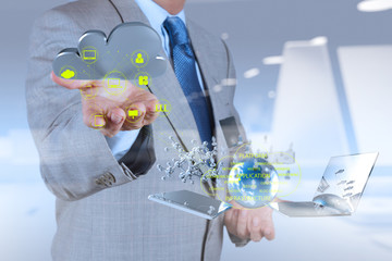 Businessman working with a Cloud Computing diagram on the new co