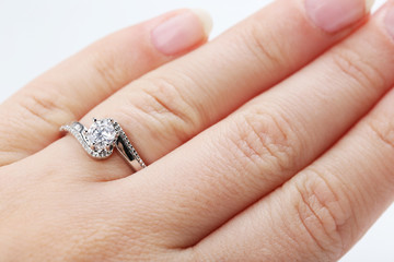 Diamond ring on the woman's finger