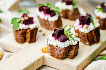 beet goat cheese arugula walnut honey crostini