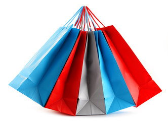 Colorful paper shopping bags isolated on white