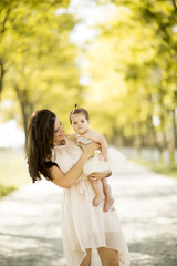 Obraz premium Mother and baby in the summer park