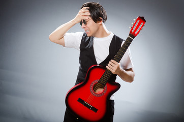 Funny guitar player in musical concept