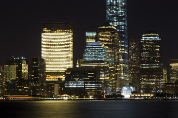 View of Lower Manhattan skyline at night from Exchange Place in Jersey City, New Jersey.