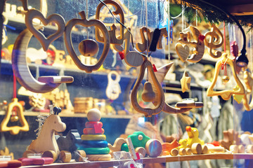 Christmas market stand with wooden toys and Christmas tree decorations in Riga, Latvia