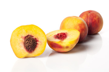 Juicy peaches on white background