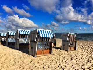 Wicker baskets on the empty beach 