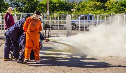 Firefighter fighting fire during training