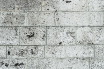 Old wall made of limestone bricks