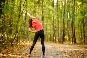 woman exercising in park