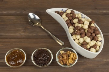 Healthy Diet breakfast of oatmeal, cereal and fruit. Foods full of energy for athletes. The concept of diet food. Preparing homemade breakfast. Vegetarian diet. Food on a wooden table.

