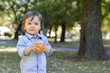 Adorable one year old child in the park