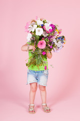 Toddler girl with flowers