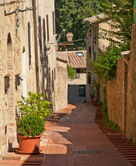 Narrow street in a village in Tuscany, Italy