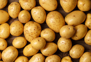 potatoes on wooden background