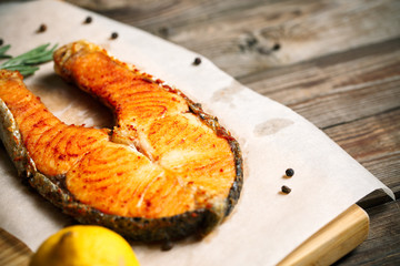 Grilled salmon on wooden table
