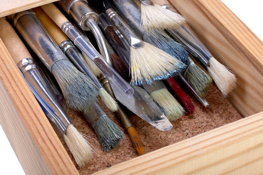 wooden box with paint brushes