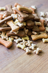 Dog biscuits on wooden background