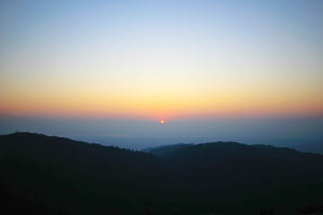 Fototapeta na wymiar Sunrise and misty hills