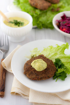 Bean Burger Without A Bun Served On A Plate With Aioli Sauce