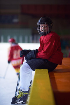children ice hockey players on bench