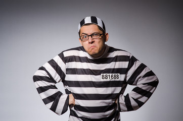 Young prisoner against gray