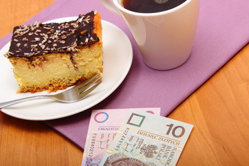 Paying for cheesecake and coffee in the cafe, finance concept