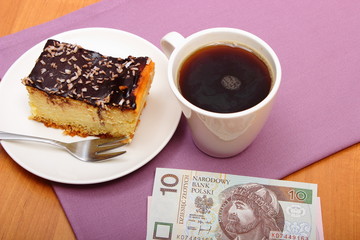 Paying for cheesecake and coffee in the cafe, finance concept