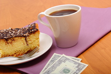 Paying for cheesecake and coffee in the cafe, finance concept