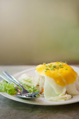 Close up Morning Delicious breakfast fried egg put on fried rice decorate with green vegetables.