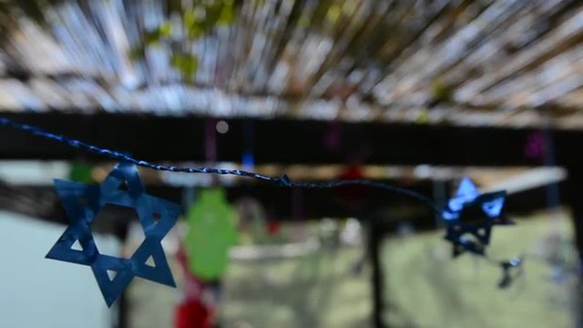 Star of David decorations inside a Jewish family Sukkah for the Jewish festival of Sukkot. A Sukkah is a temporary structure where meals are taken for the week.