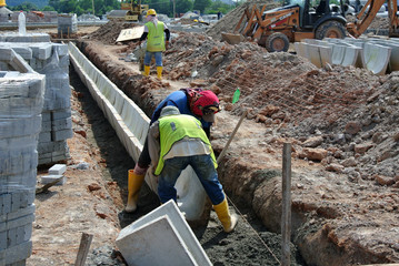 V-shaped trench drain at the construction site  - obrazy, fototapety, plakaty