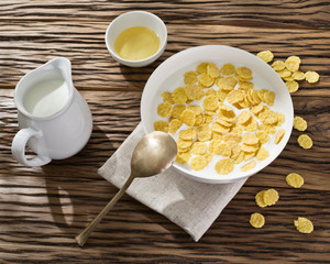 Cornflakes cereal and milk.