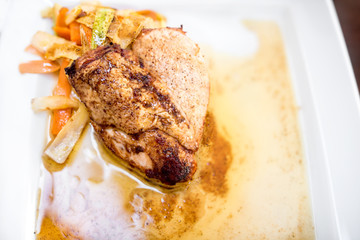 Grilled chicken breast fillet with stir vegetables and spicy honey sauce. Main dish at restaurant