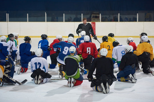 ice hockey players team meeting with trainer
