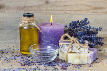 Obraz na płótnie Canvas Lavender oil, lavender flowers, handmade soap and sea salt with