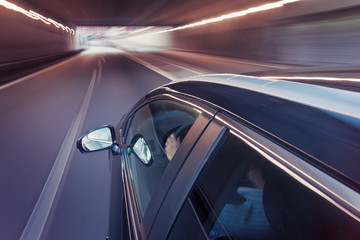 Obraz na płótnie Canvas Car driving through a tunnel