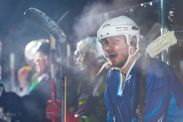 ice hockey players on bench