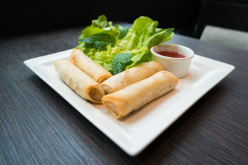 Spring rolls served with dipping sauce