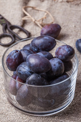 Plums in a glass bowl.