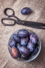 Plums in a glass bowl.