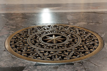 Ancient bronze lattice on the vent hole in the floor