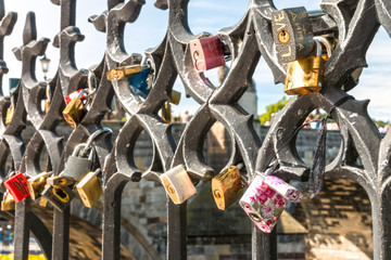 Love Locks on Fence with Charles Bridge on background, Prague, Bohemia, Czech republic, Central Europe