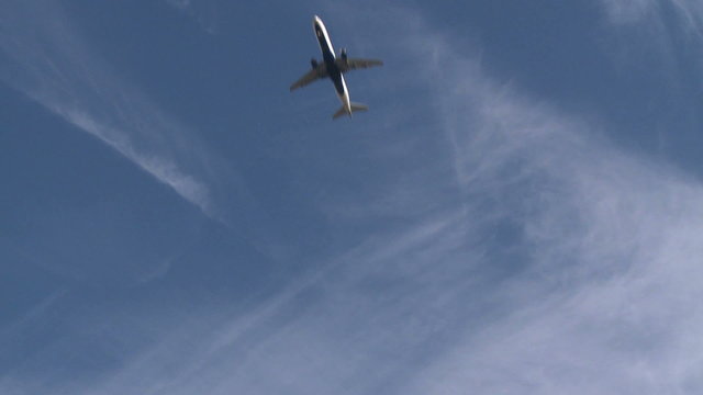 Plane descending from the clouds