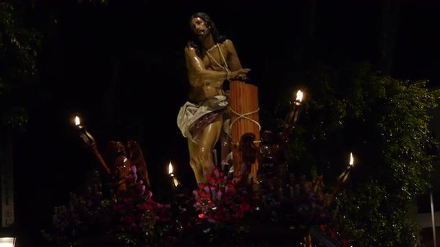  Christ of the Gypsies, at night, with lights burning at the four corners      