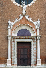 Fototapeta na wymiar Decorated church doors in Venice