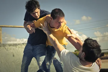 Foto op Plexiglas Three young guys in a fight © olly