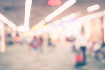 Blurred background : Traveler with baggage at airport terminal b